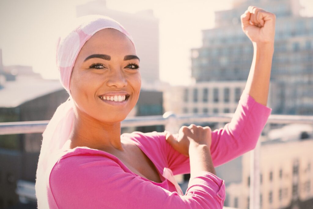 Strong woman in city with breast cancer awareness