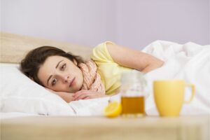 woman in bed sick